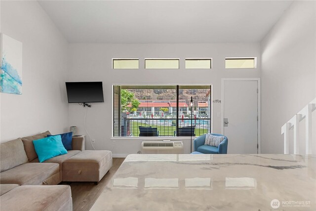 8903 Crescent Bar Rd Unit 158, Quincy, WA 98848 - living room featuring wood finished floors and an AC wall unit