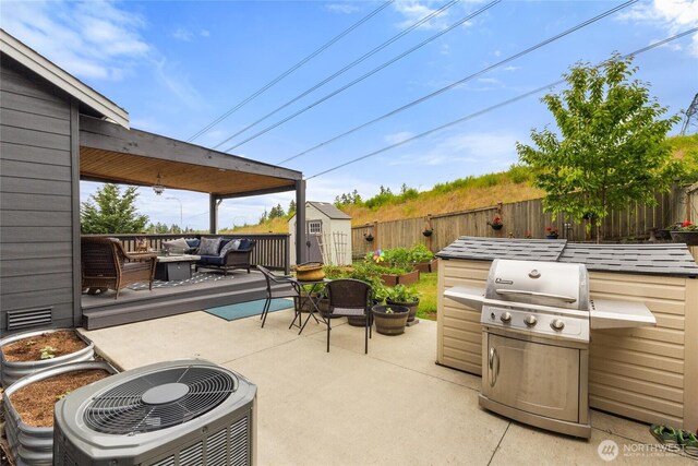5418 Bennett Ave SE, Auburn, WA 98092 - fenced backyard featuring an outdoor living space, a patio, and central AC