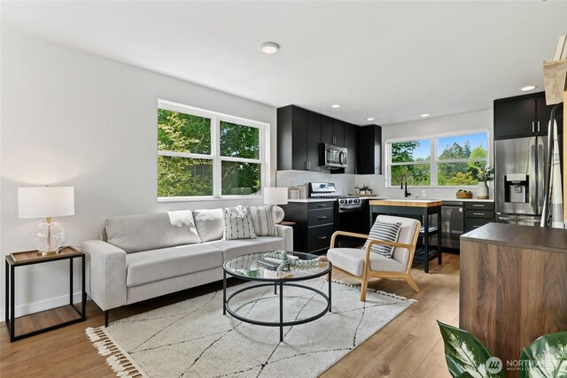 6014 40th Ave NE Unit B, Seattle, WA 98115 - living area featuring light wood-type flooring and recessed lighting