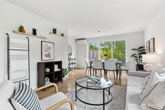6014 40th Ave NE Unit B, Seattle, WA 98115 - living area with a wall mounted air conditioner and light wood finished floors