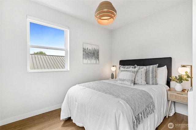 6014 40th Ave NE Unit B, Seattle, WA 98115 - bedroom featuring baseboards and wood finished floors