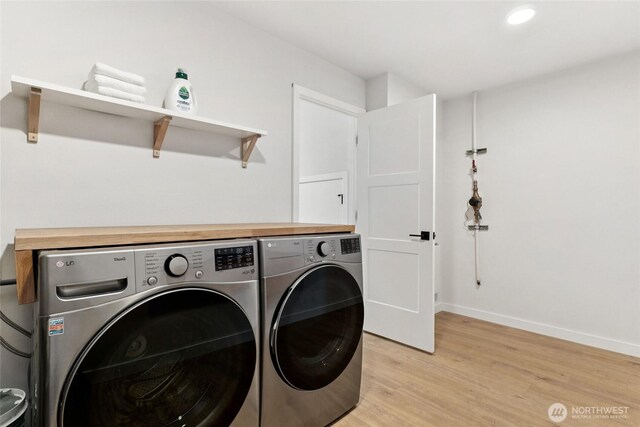 6014 40th Ave NE Unit B, Seattle, WA 98115 - laundry area with independent washer and dryer, light wood-style floors, baseboards, and recessed lighting