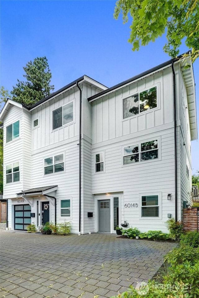 6014 40th Ave NE Unit B, Seattle, WA 98115 - view of property featuring board and batten siding and a garage