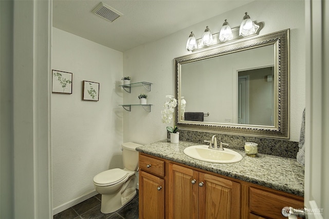 109 77th Pl SW, Everett, WA 98203 - bathroom featuring vanity, toilet, tile patterned flooring, and baseboards
