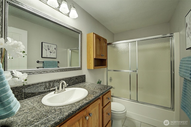 109 77th Pl SW, Everett, WA 98203 - bathroom featuring vanity, toilet, bath / shower combo with glass door, and tile patterned flooring
