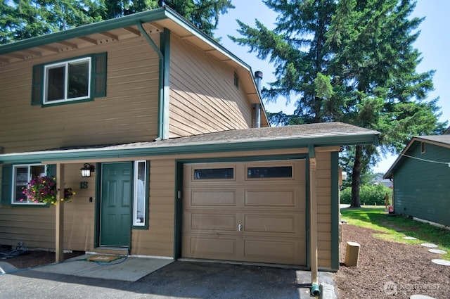 3217 Yelm Hwy SE Unit 18, Olympia, WA 98501 - view of front facade featuring asphalt driveway and a garage