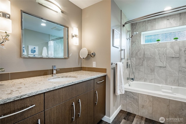 8054 Makah Rd, Birch Bay, WA 98230 - bathroom featuring wood finished floors, vanity, and tiled shower / bath combo