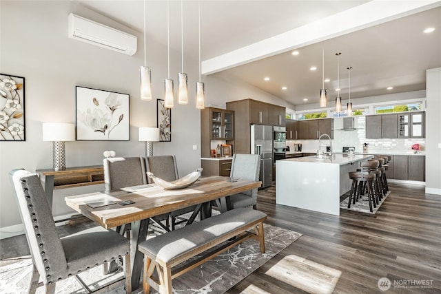 8054 Makah Rd, Birch Bay, WA 98230 - dining room with a wall mounted air conditioner, dark wood-type flooring, recessed lighting, and vaulted ceiling