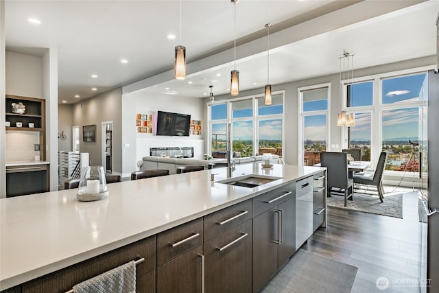 8054 Makah Rd, Birch Bay, WA 98230 - kitchen with light countertops, dark wood finished floors, stainless steel dishwasher, plenty of natural light, and recessed lighting