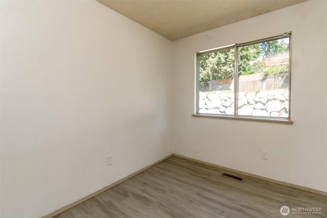 28312 22nd Ave S, Federal Way, WA 98003 - empty room featuring wood finished floors and baseboards