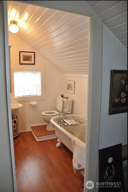 3504 L Pl, Seaview, WA 98644 - bathroom with vaulted ceiling, wood finished floors, toilet, and wooden ceiling