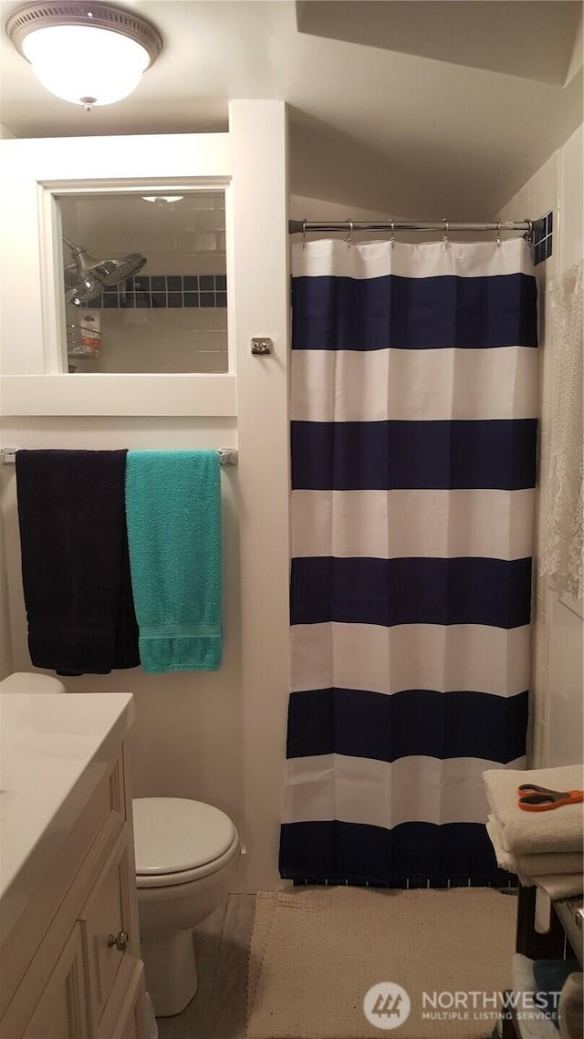 3504 L Pl, Seaview, WA 98644 - full bathroom featuring vanity, toilet, curtained shower, and tile patterned flooring