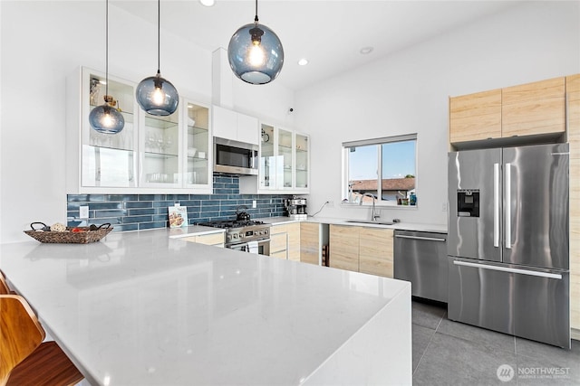 8068 Niska Rd, Blaine, WA 98230 - kitchen with stainless steel appliances, a peninsula, modern cabinets, and recessed lighting
