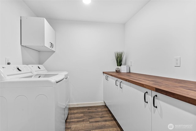8068 Niska Rd, Blaine, WA 98230 - laundry room with cabinet space, separate washer and dryer, and dark wood-type flooring