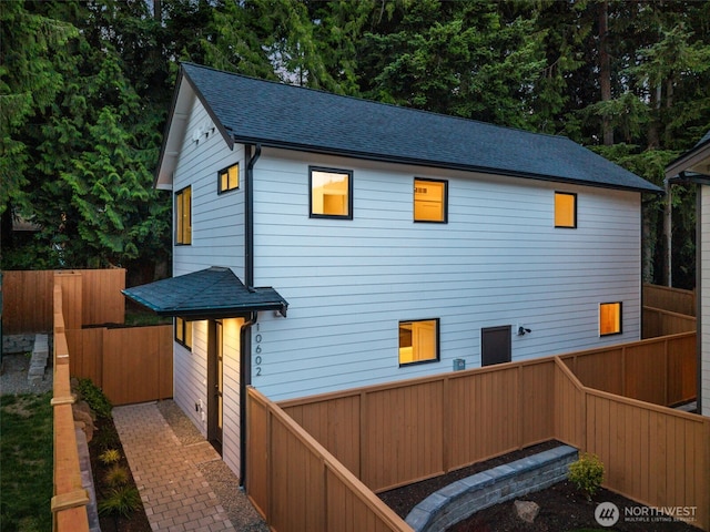 10602 NE 137th Pl, Kirkland, WA 98033 - back of property featuring roof with shingles and a fenced backyard