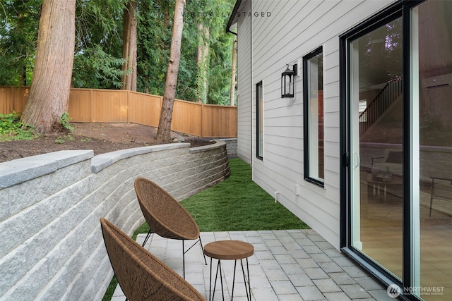 10602 NE 137th Pl, Kirkland, WA 98033 - fenced backyard featuring a patio area