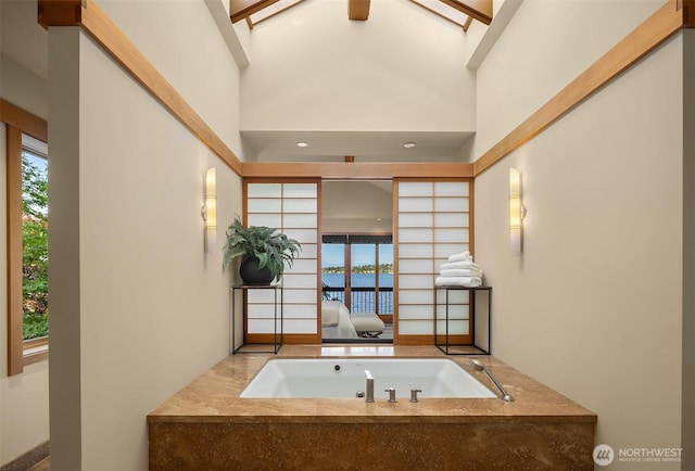 1104 Lakeside Ave S, Seattle, WA 98144 - bathroom featuring plenty of natural light, a tub with jets, ensuite bathroom, and high vaulted ceiling