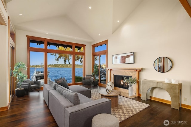 1104 Lakeside Ave S, Seattle, WA 98144 - living area featuring a fireplace, high vaulted ceiling, dark wood finished floors, a water view, and recessed lighting