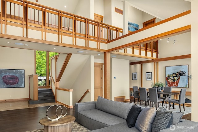 1104 Lakeside Ave S, Seattle, WA 98144 - living room featuring a towering ceiling, wood finished floors, and stairway