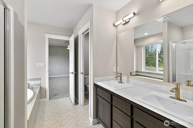 812 Bodie Ct SE, Lacey, WA 98513 - bathroom featuring a garden tub, a shower stall, double vanity, and a ceiling fan