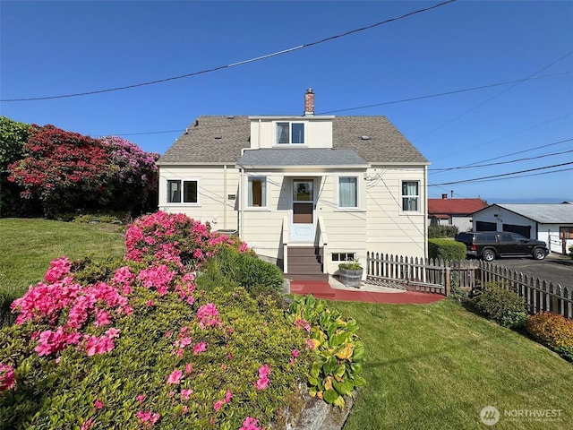 13151/2 W 5th St, Port Angeles, WA 98363 - back of property featuring entry steps, a chimney, and a shingled roof