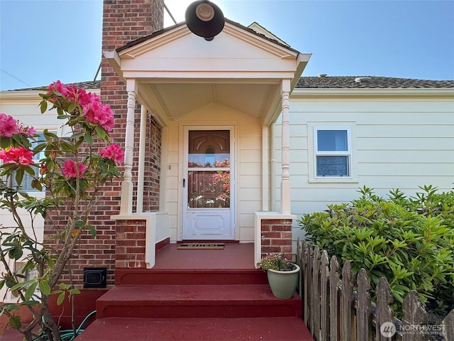 13151/2 W 5th St, Port Angeles, WA 98363 - property entrance featuring a chimney and brick siding