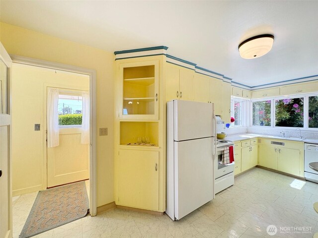 13151/2 W 5th St, Port Angeles, WA 98363 - kitchen with white appliances, light countertops, a sink, light marble finish flooring, and baseboards
