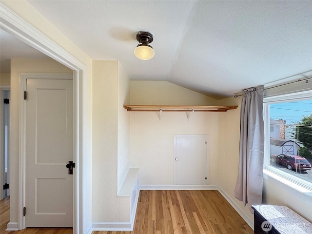 13151/2 W 5th St, Port Angeles, WA 98363 - laundry room featuring light wood-type flooring and baseboards