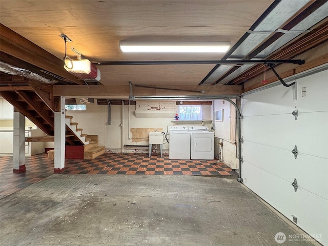13151/2 W 5th St, Port Angeles, WA 98363 - garage with washing machine and clothes dryer, a garage door opener, and a sink