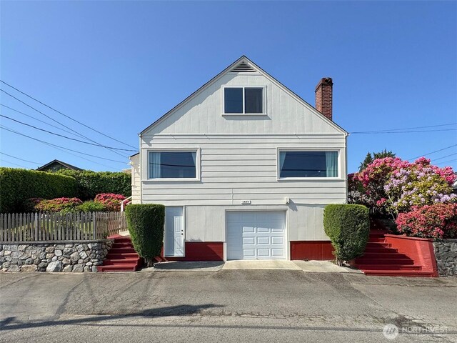 13151/2 W 5th St, Port Angeles, WA 98363 - view of home's exterior featuring a chimney and stairs