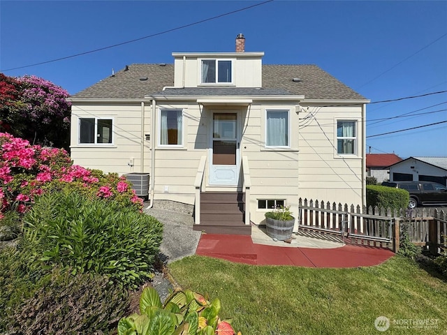 13151/2 W 5th St, Port Angeles, WA 98363 - back of house featuring entry steps, cooling unit, a chimney, and a shingled roof