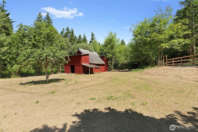 29722 State Highway 3 NE, Poulsbo, WA 98370 - view of yard featuring a barn, an outbuilding, and a forest view