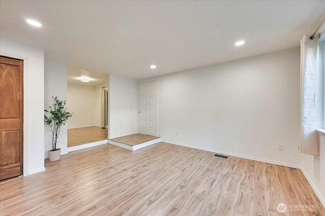 12712 NE 120th St Unit G1, Kirkland, WA 98034 - unfurnished room featuring light wood-style floors, recessed lighting, and baseboards