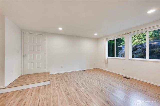 12712 NE 120th St Unit G1, Kirkland, WA 98034 - empty room featuring light wood-type flooring, recessed lighting, and baseboards