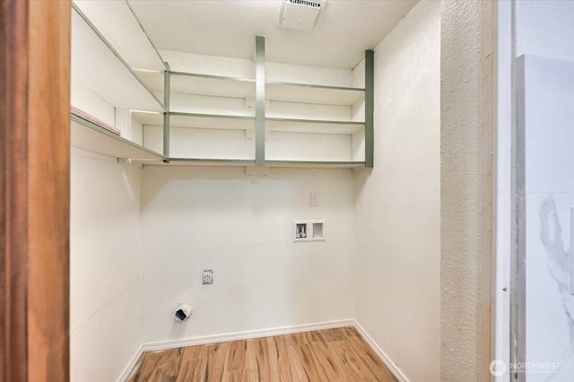 12712 NE 120th St Unit G1, Kirkland, WA 98034 - laundry area with washer hookup, light wood-type flooring, hookup for an electric dryer, and baseboards