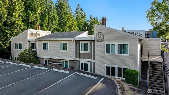 12712 NE 120th St Unit G1, Kirkland, WA 98034 - view of building exterior with uncovered parking
