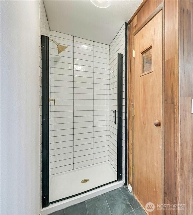 12712 NE 120th St Unit G1, Kirkland, WA 98034 - full bathroom featuring a shower stall and tile patterned flooring