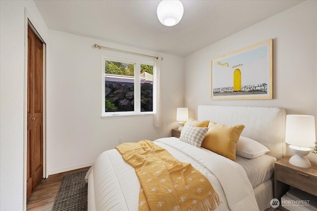 12712 NE 120th St Unit G1, Kirkland, WA 98034 - bedroom with wood finished floors and baseboards