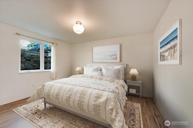 12712 NE 120th St Unit G1, Kirkland, WA 98034 - bedroom with wood finished floors and baseboards