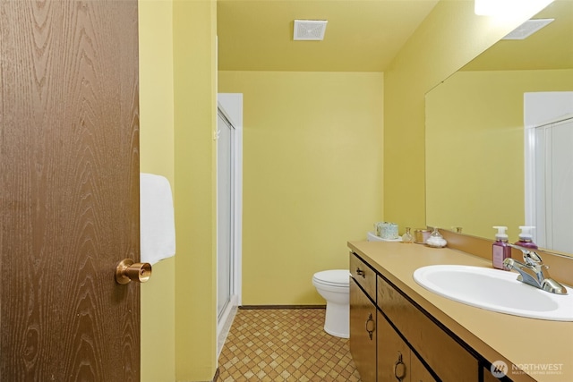 10610-10608 109th St SW, Lakewood, WA 98498 - bathroom with vanity, toilet, a shower with shower door, and baseboards