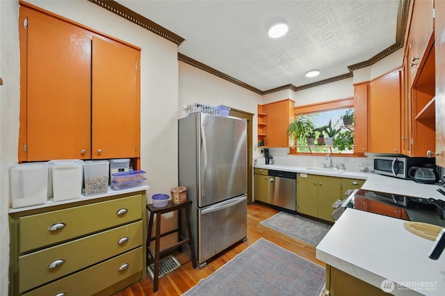 507 S 3rd St, Dayton, WA 99328 - kitchen featuring open shelves, stainless steel appliances, ornamental molding, light wood-type flooring, and a sink