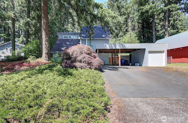 10012 NE 39th St, Vancouver, WA 98662 - view of front of property with asphalt driveway, an outdoor structure, and metal roof