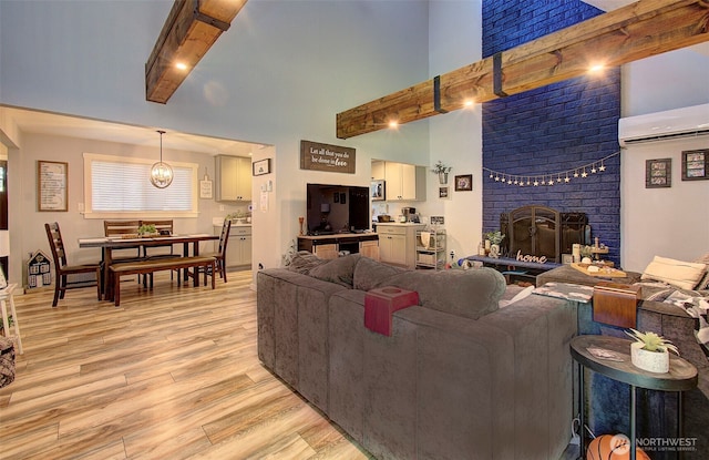 10012 NE 39th St, Vancouver, WA 98662 - living area with light wood finished floors, a brick fireplace, a high ceiling, and a wall mounted AC