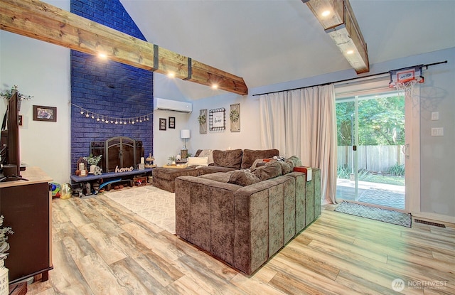10012 NE 39th St, Vancouver, WA 98662 - living area with a wall unit AC, light wood-style flooring, and a brick fireplace