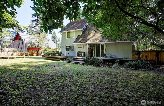 10012 NE 39th St, Vancouver, WA 98662 - rear view of property with a trampoline and a deck