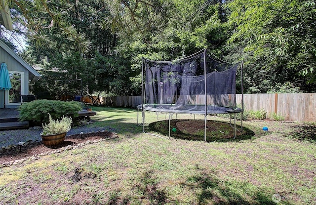10012 NE 39th St, Vancouver, WA 98662 - view of yard with a trampoline and a wooden deck