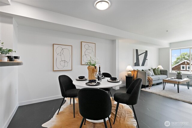 1909 10th Ave W Unit 203, Seattle, WA 98119 - dining room with baseboards