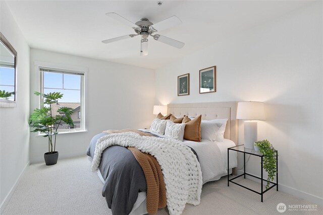 1909 10th Ave W Unit 203, Seattle, WA 98119 - carpeted bedroom featuring baseboards and a ceiling fan