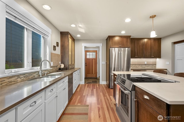 1605 Donovan Ave, Bellingham, WA 98225 - kitchen featuring appliances with stainless steel finishes, a center island, backsplash, recessed lighting, and decorative light fixtures