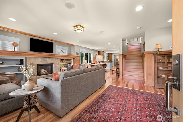 1605 Donovan Ave, Bellingham, WA 98225 - living room featuring light wood-type flooring, stairs, recessed lighting, and a stone fireplace